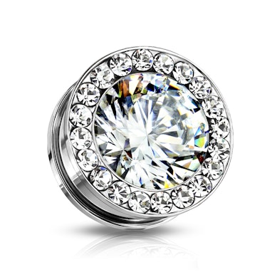 Plug mit einem großen und vielen kleinen Steinen